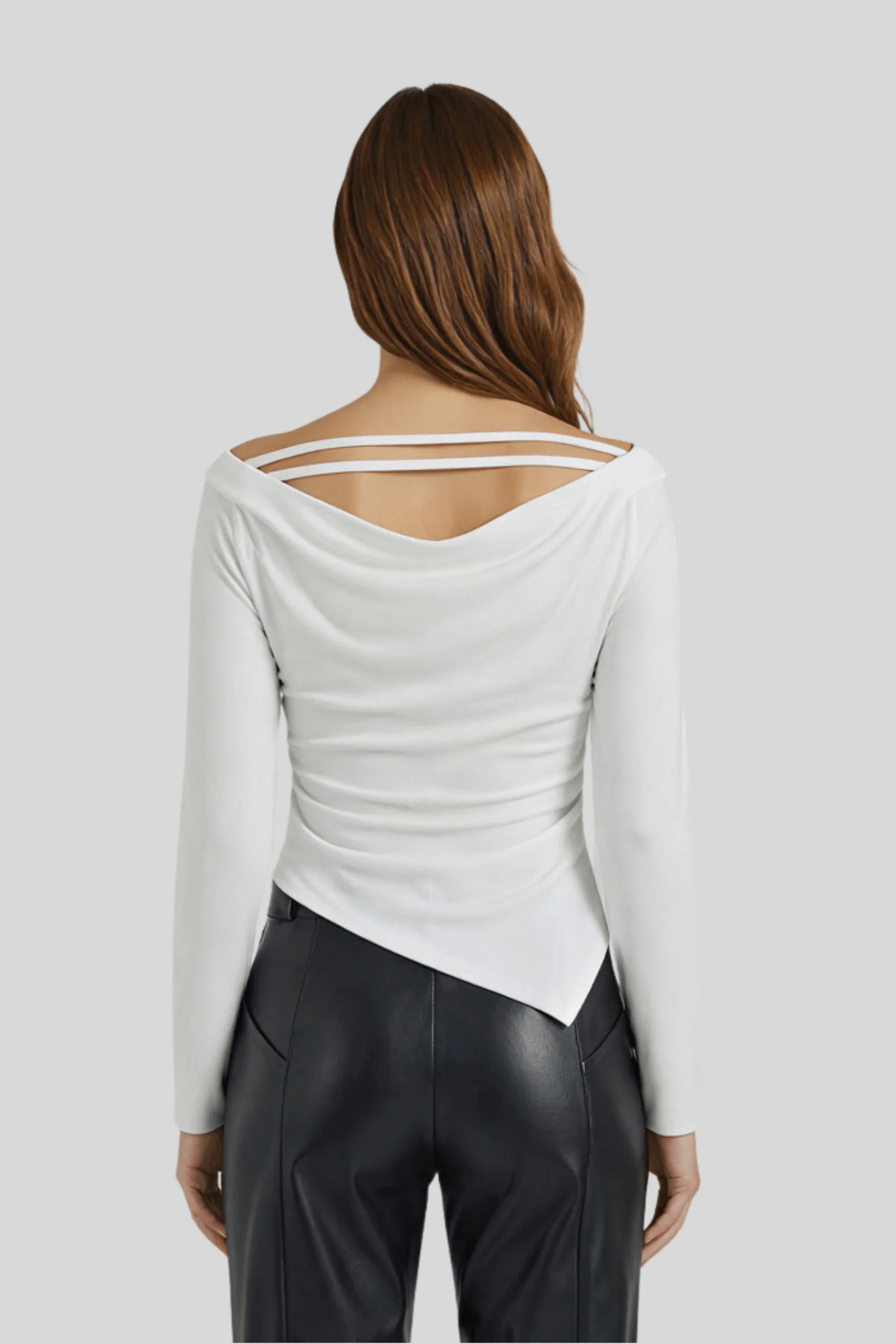 A white knit top with a fitted cut and asymmetrical lines