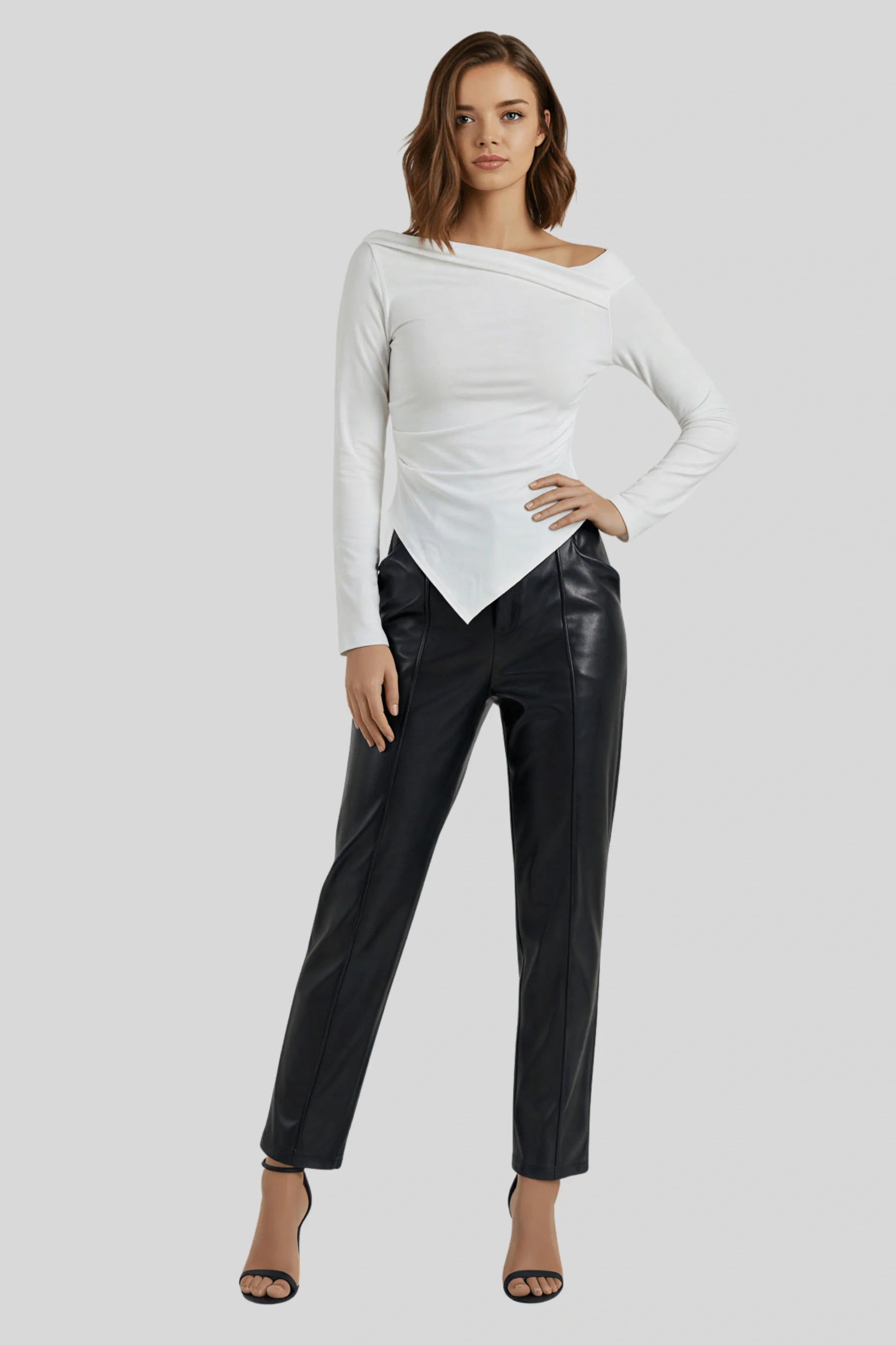 A white knit top with a fitted cut and asymmetrical lines