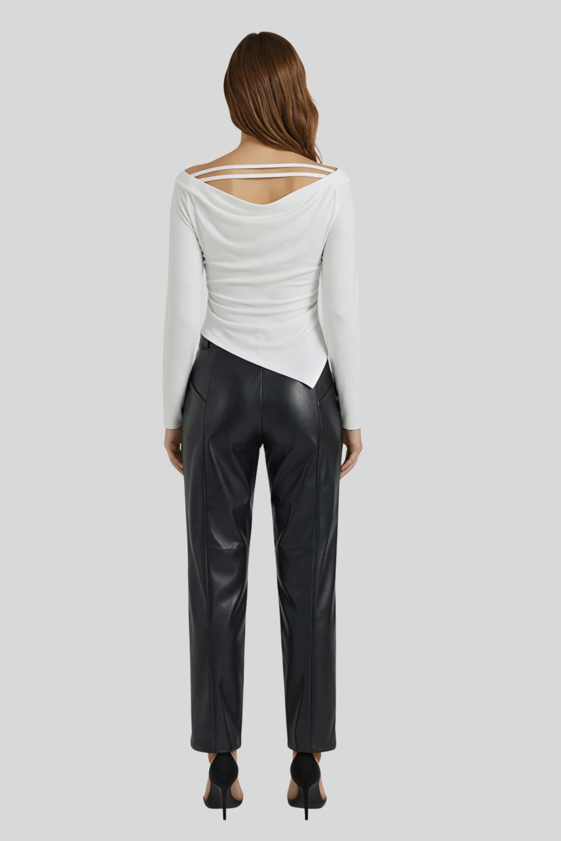 A white knit top with a fitted cut and asymmetrical lines