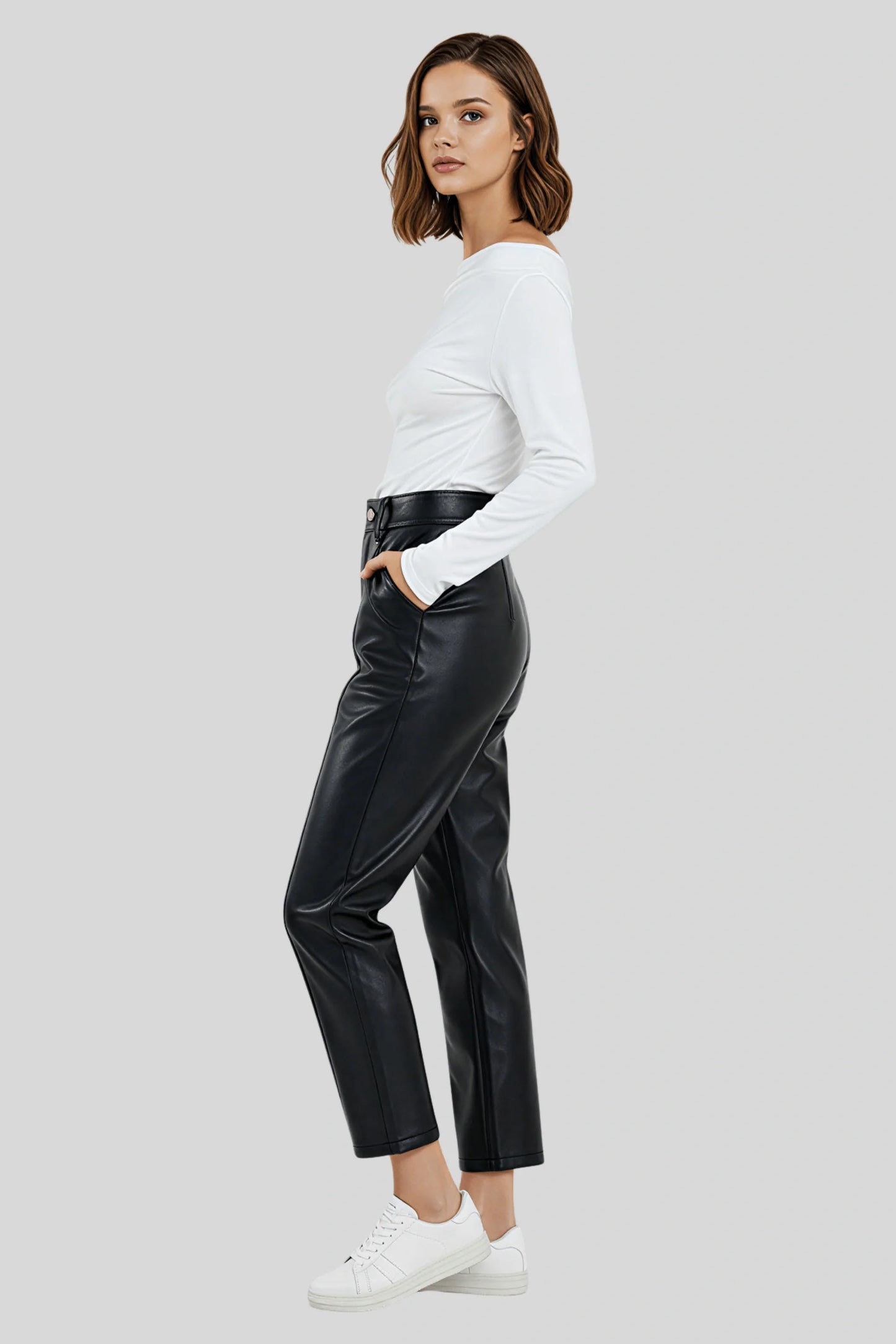 A white knit top with a fitted cut and asymmetrical lines