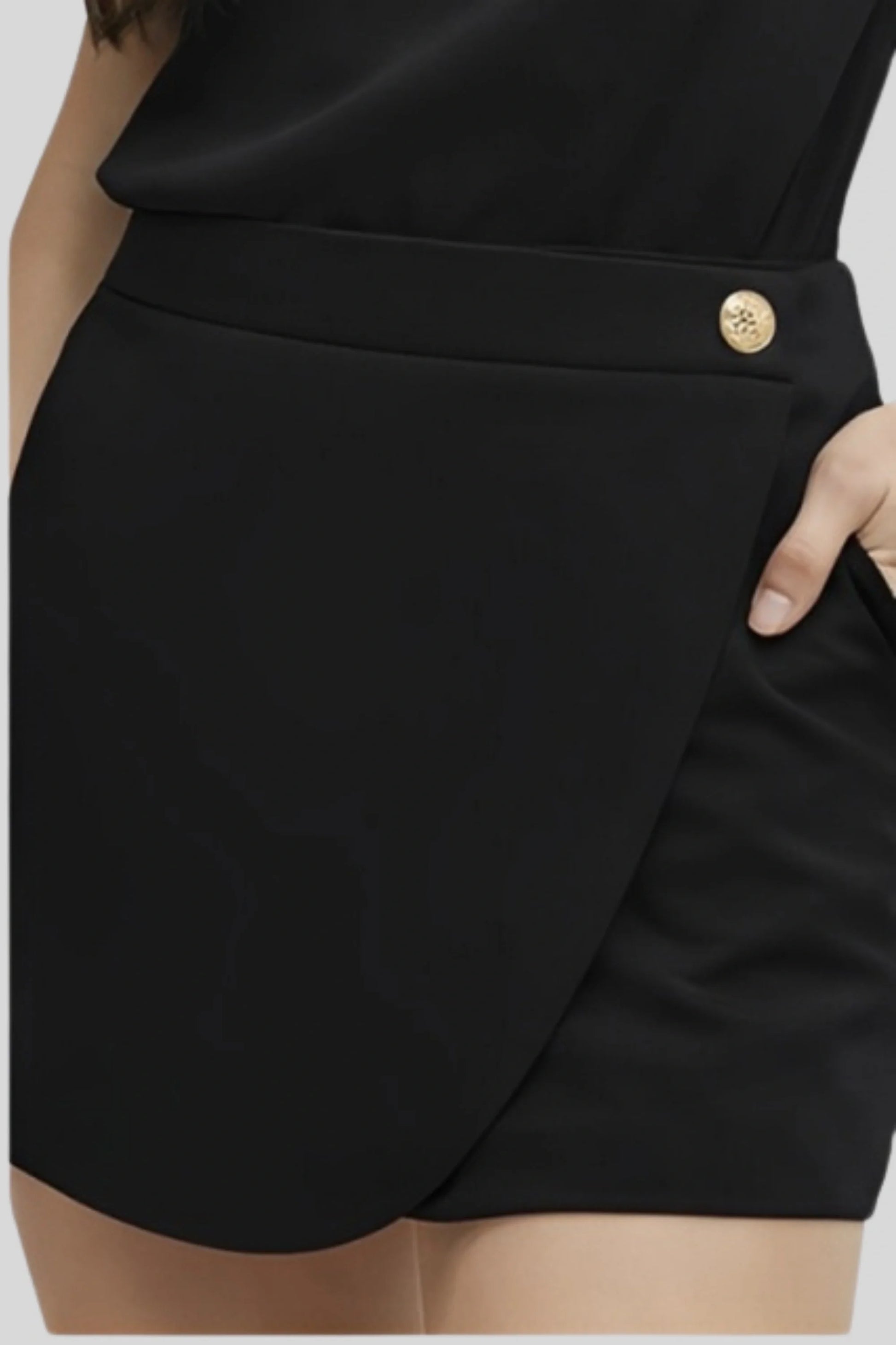 The Asymmetrical Skort That Keeps the Silhouette Secure Black